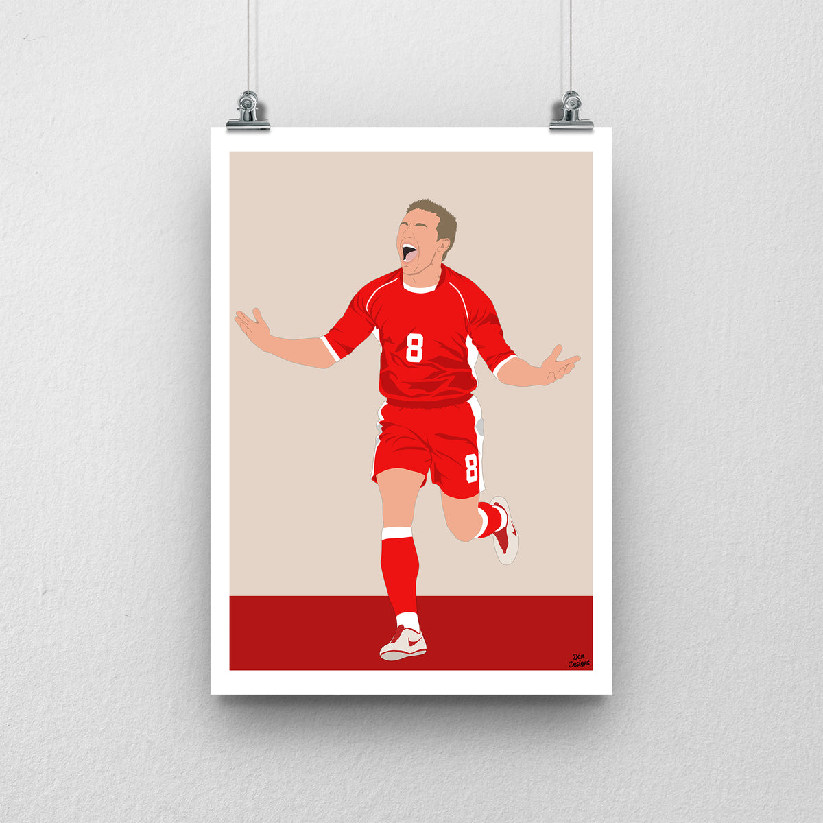 Craig Bellamy Wales print, running with his arms spread in celebration, with a beige and red background and white border.