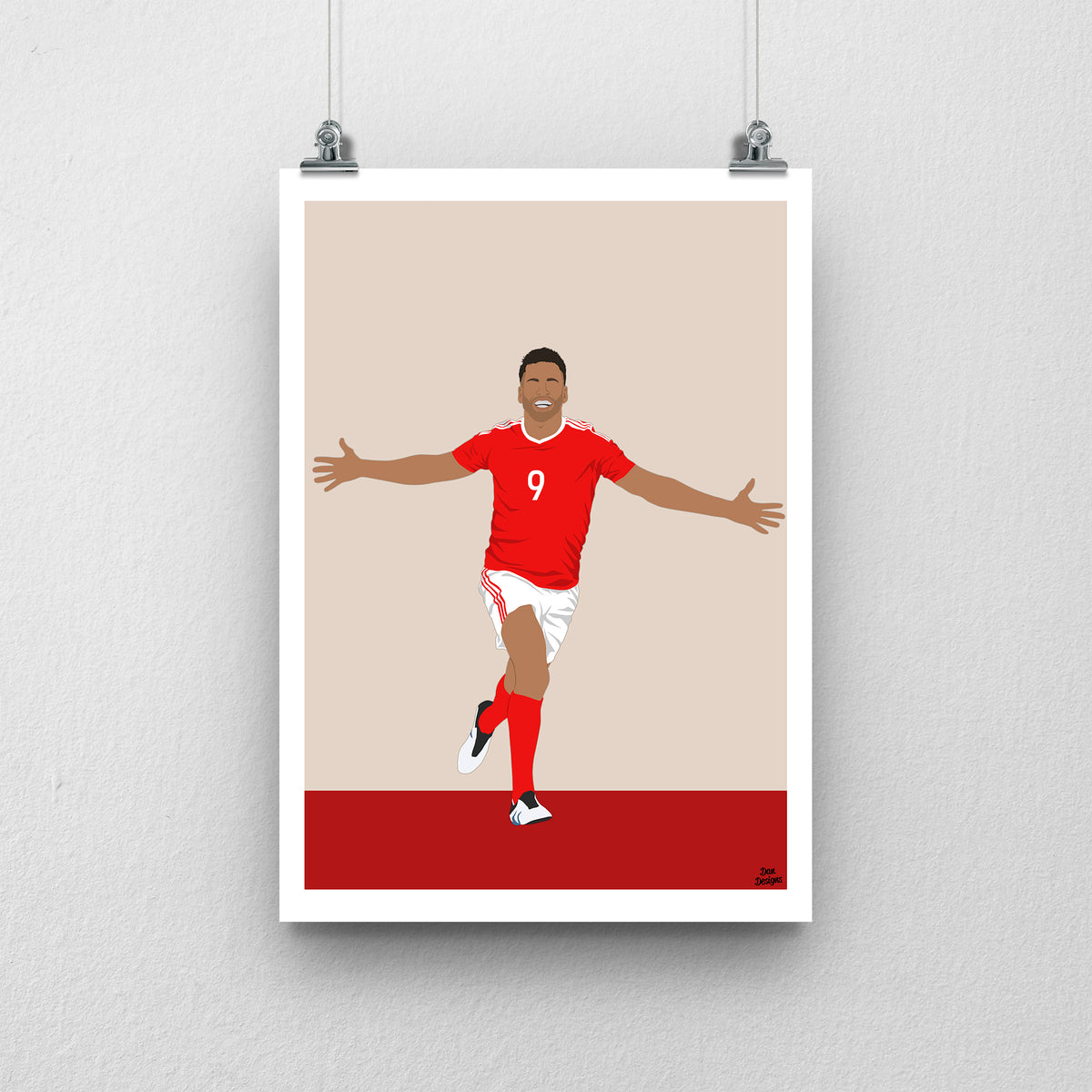 Hal Robson-Kanu Wales print, celebrating with both arms outstretched, with a beige and red background and white border.