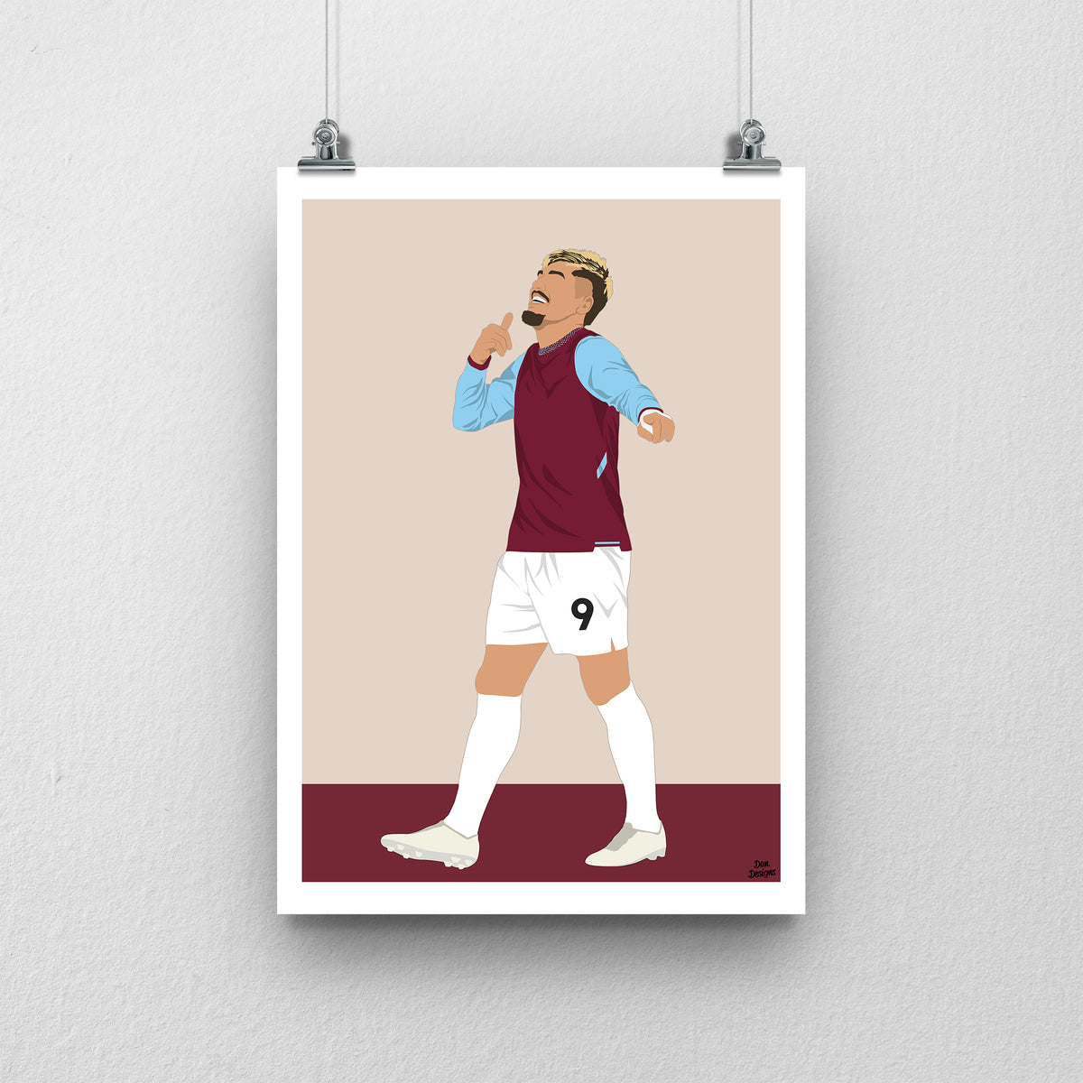 Joël Piroe in West Ham's claret shirt with sky-blue sleeves, holding a finger to his lips with his other arm extended, against a beige background with a white border and claret base.