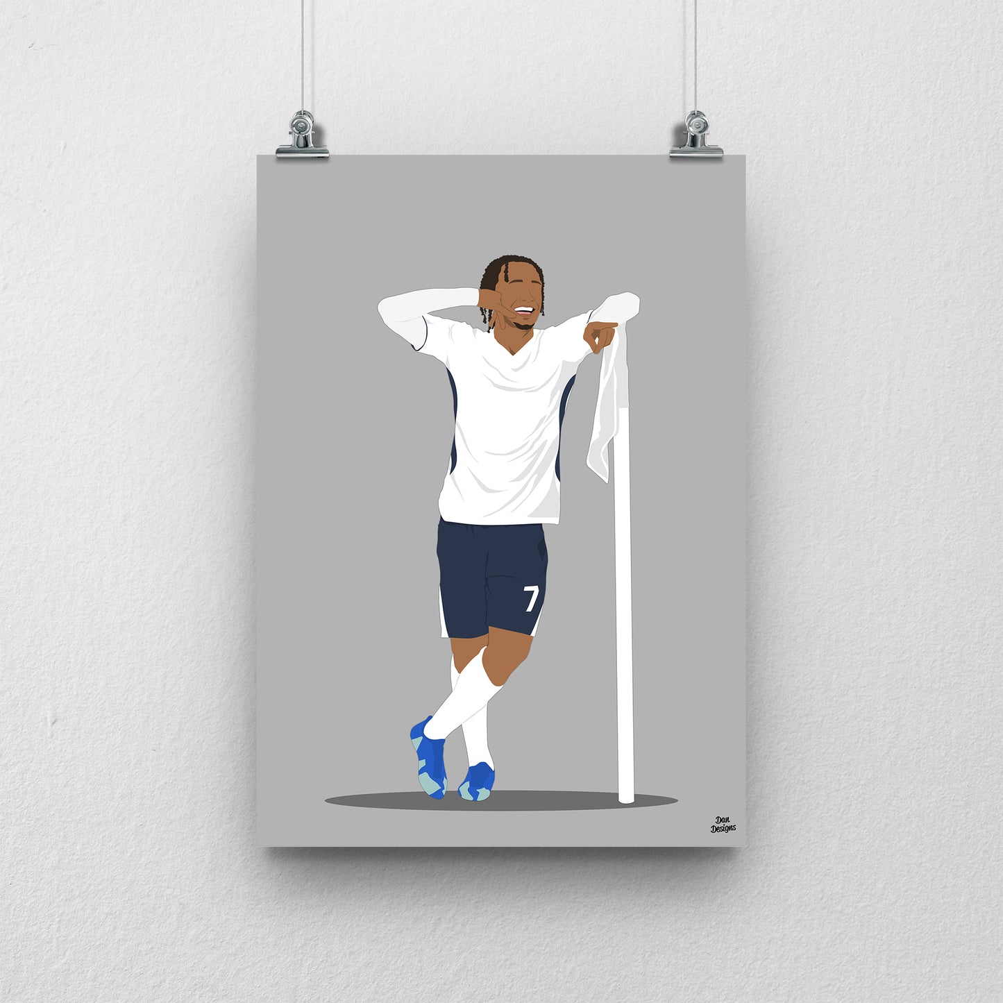 Xavi Simons Tottenham art print, posing beside a corner flag with one hand behind his head in a white Tottenham shirt and navy shorts, with a grey background.