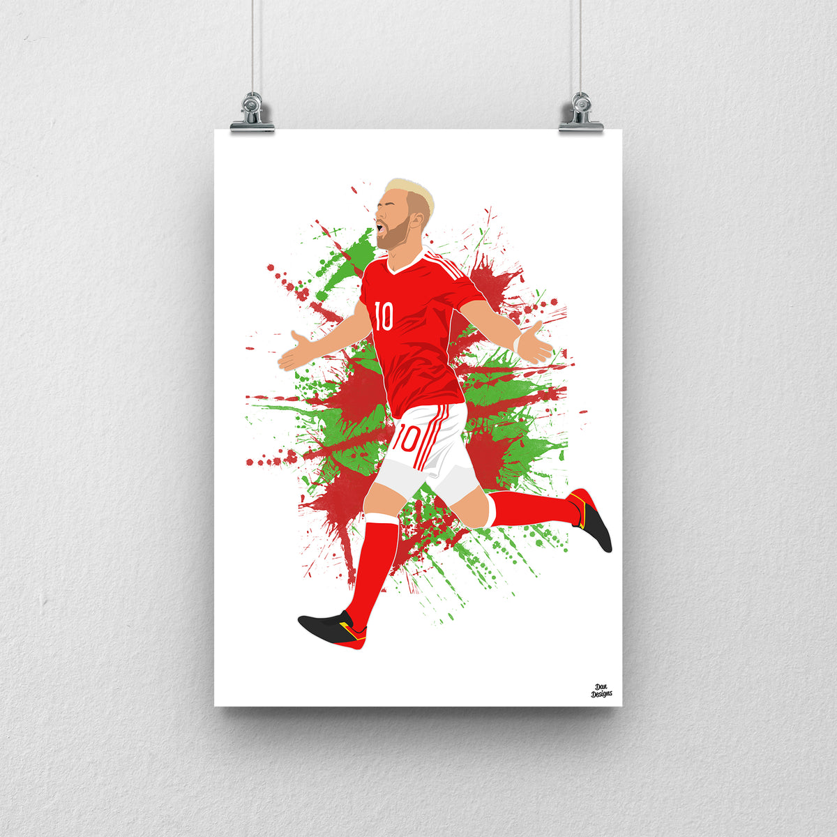 Aaron Ramsey Wales print, running with his arms out in celebration, on a red and green paint-splatter background.