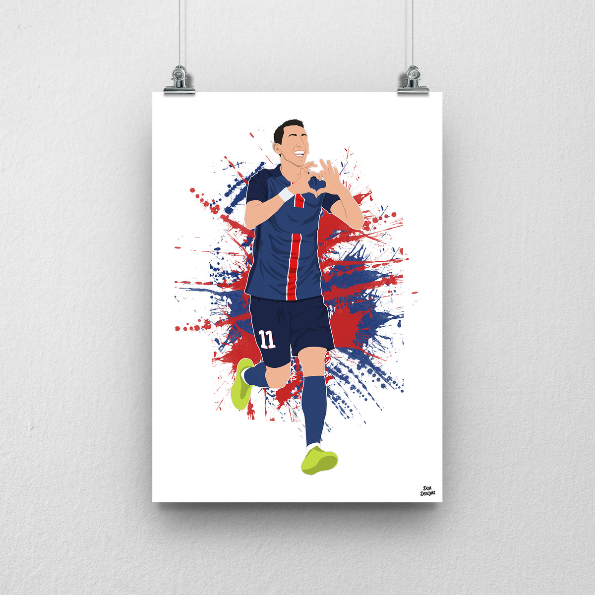 Ángel Di María art print, running in PSG's navy kit and making a heart shape with his hands, against a red-and-blue paint-splatter background.