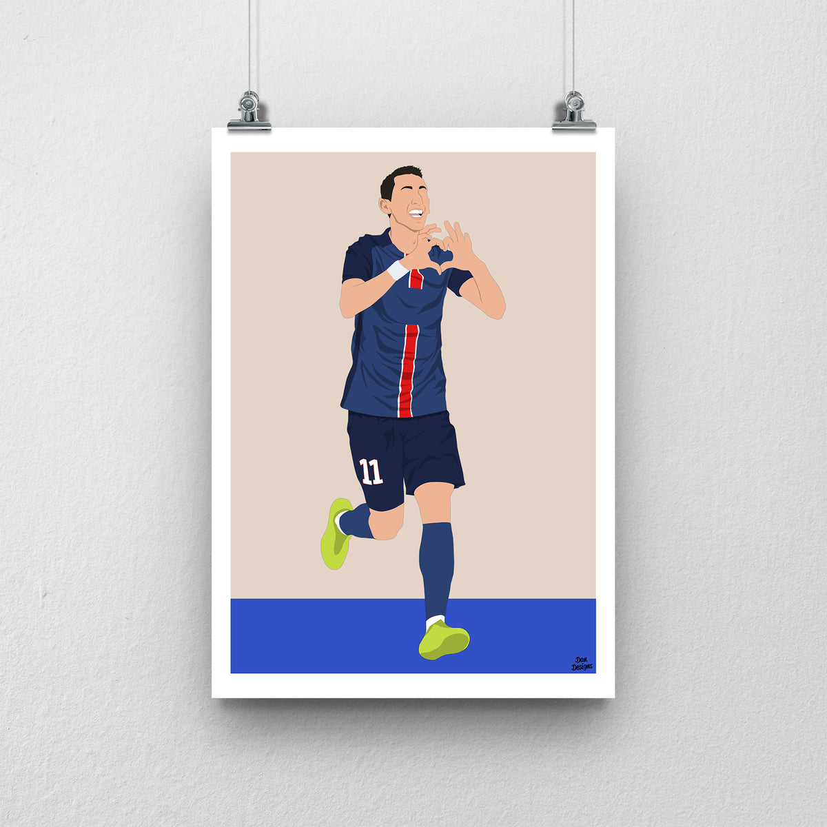 Ángel Di María art print, running in PSG's navy kit and making a heart shape with his hands, against a beige background with a white border and blue base.