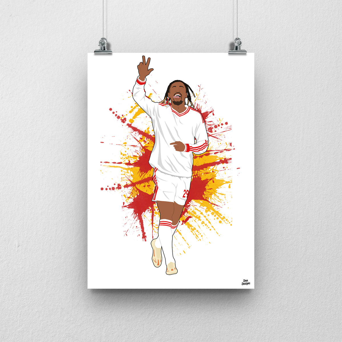 Bradley Barcola Liverpool print, celebrating with one hand raised in the white away kit, on a red and yellow paint-splatter background.