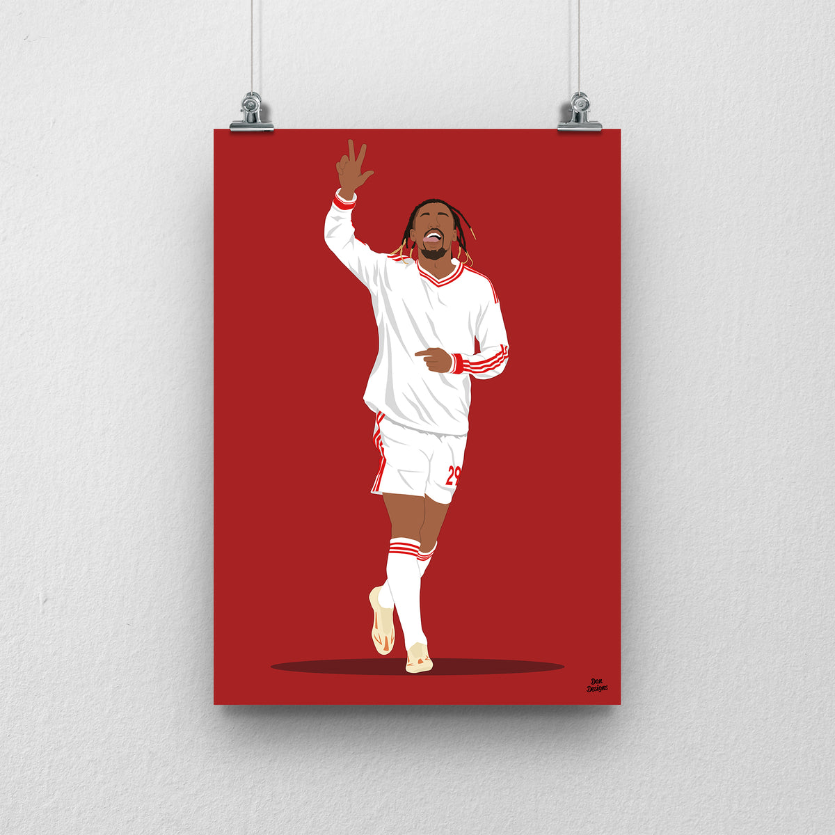 Bradley Barcola Liverpool print, celebrating with one hand raised in the white away kit, on a red background.