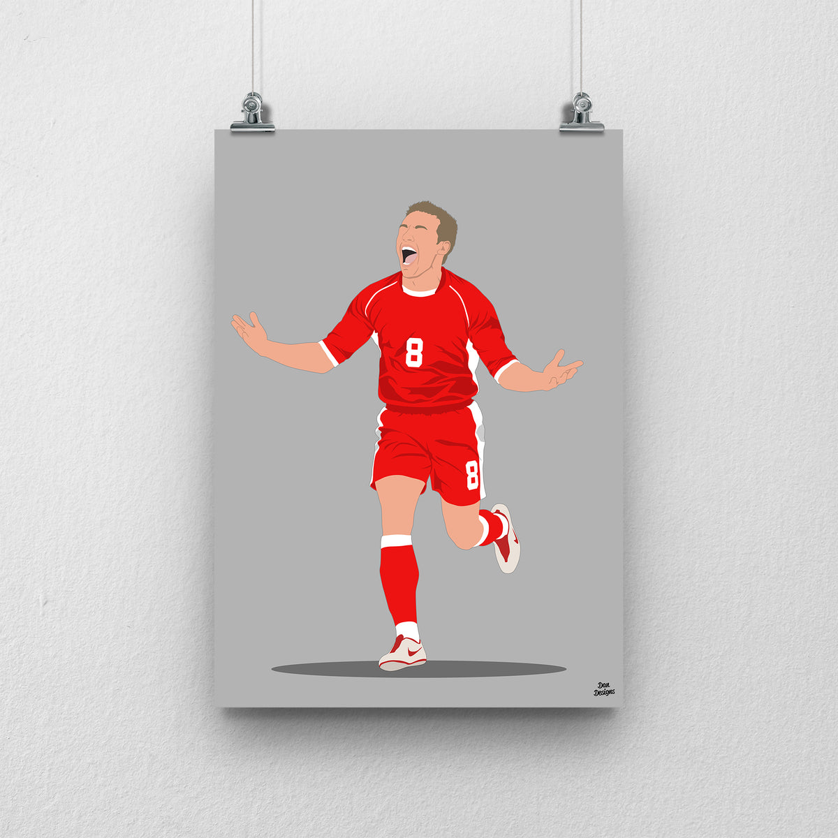 Craig Bellamy Wales print, running with his arms spread in celebration, on a grey background.