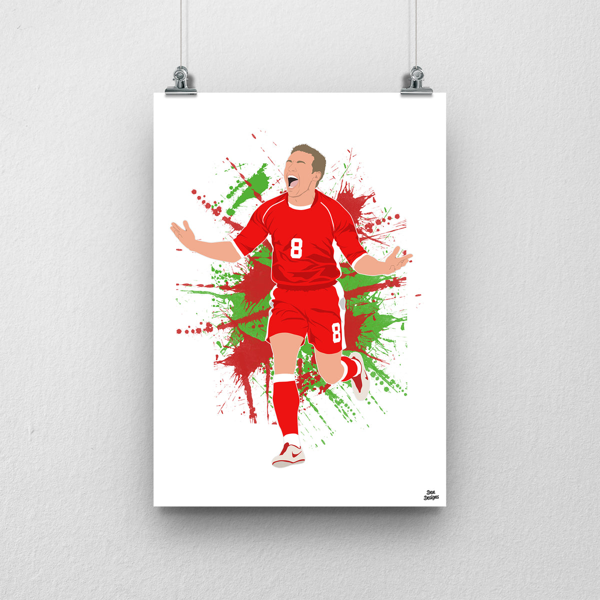 Craig Bellamy Wales print, running with his arms spread in celebration, on a red and green paint-splatter background.