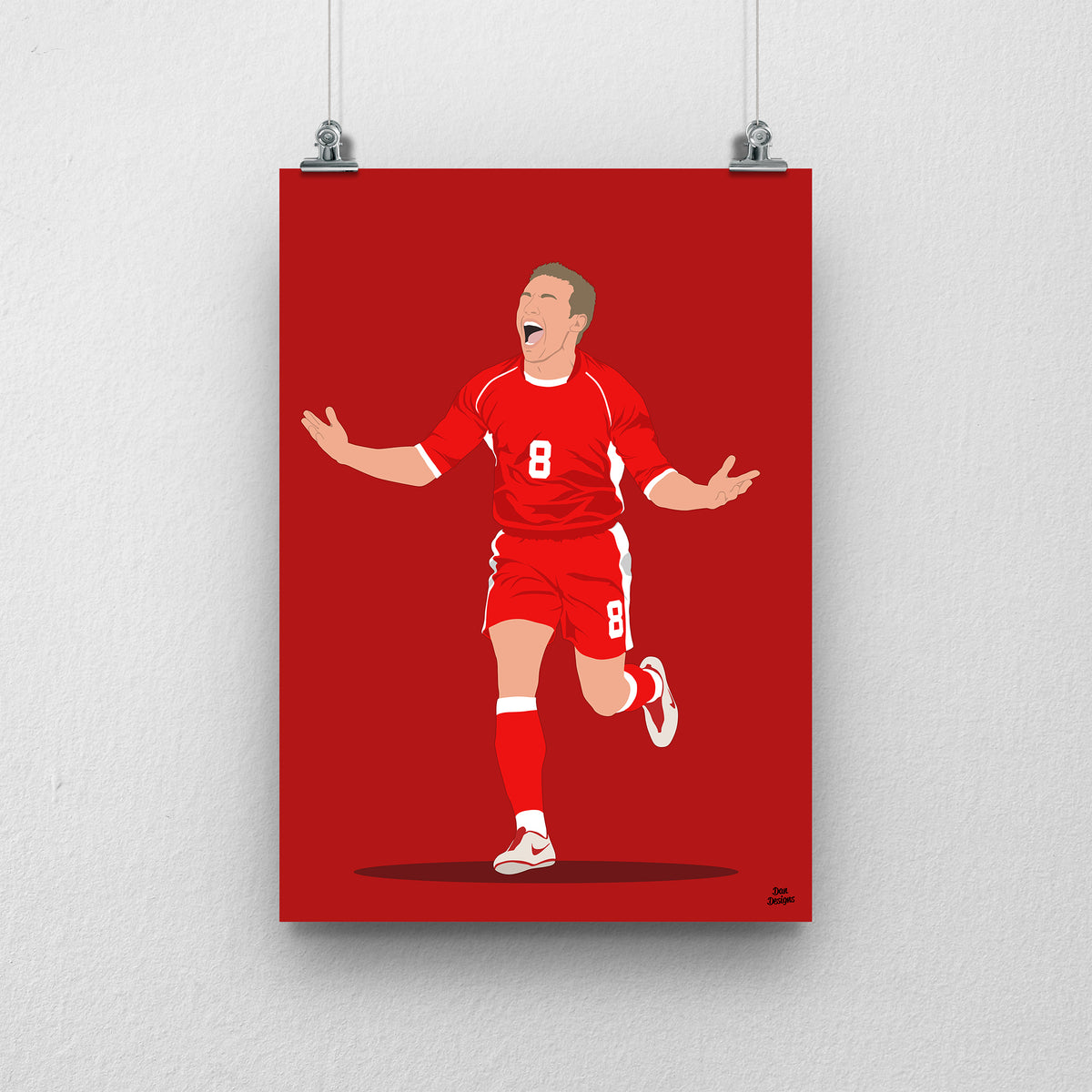 Craig Bellamy Wales print, running with his arms spread in celebration, on a red background.