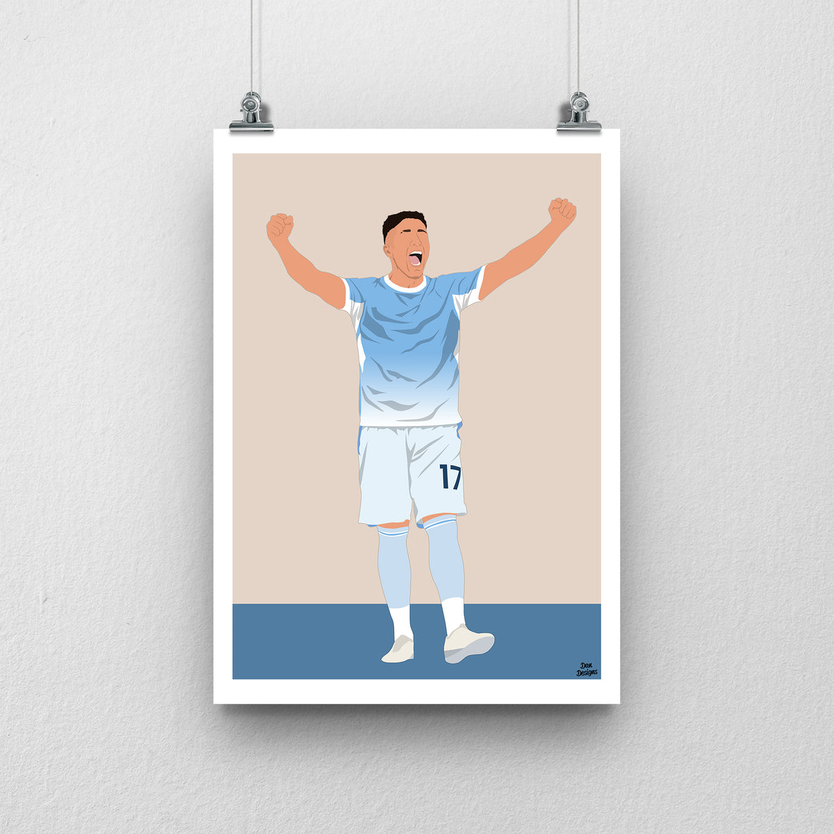 Enzo Fernández art print, celebrating with both arms raised in Manchester City's sky-blue shirt and white shorts, against a beige background with a white border and blue base.