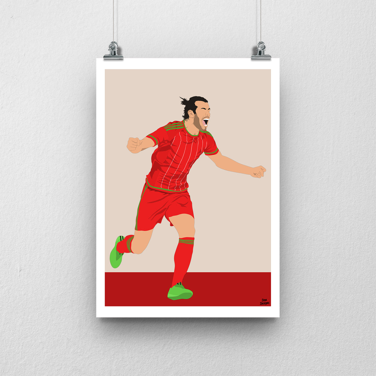 Gareth Bale Wales print, running in celebration, with a beige and red background and white border.