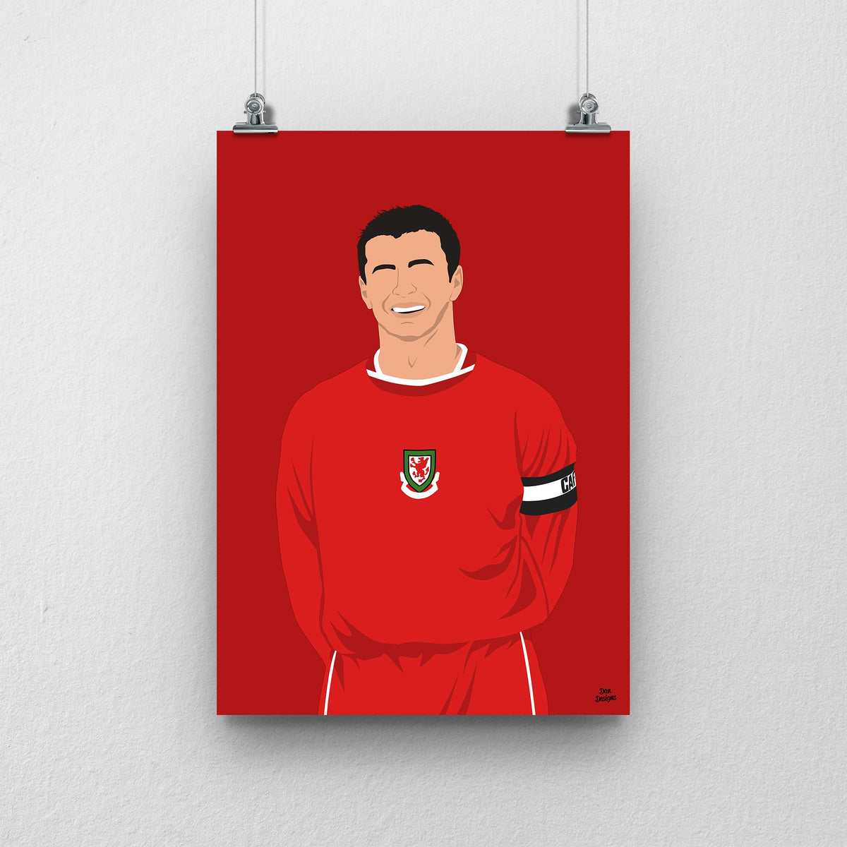 Gary Speed Wales print, smiling in the red Wales shirt with the captain’s armband, on a red background.