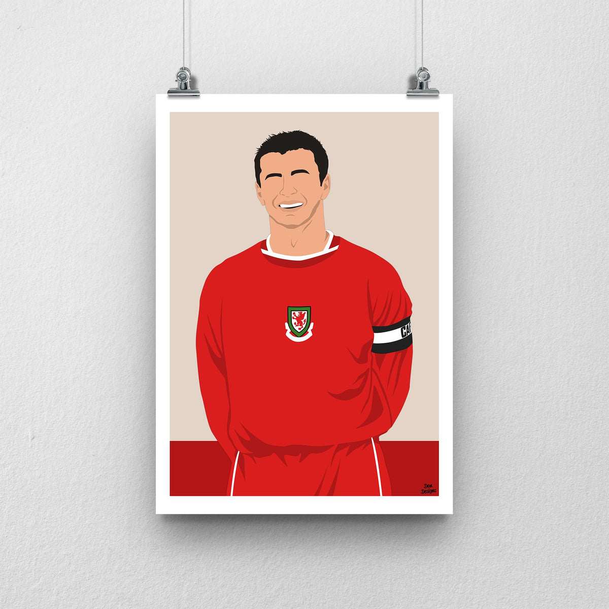 Gary Speed Wales print, smiling in the red Wales shirt with the captain’s armband, with a beige-and-red design and white border.