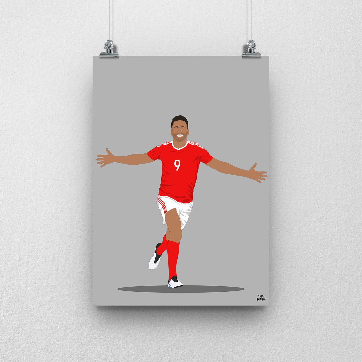 Hal Robson-Kanu Wales print, celebrating with both arms outstretched, on a grey background.