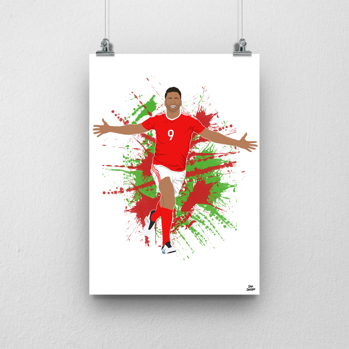 Hal Robson-Kanu Wales print, celebrating with both arms outstretched, on a red and green paint-splatter background.