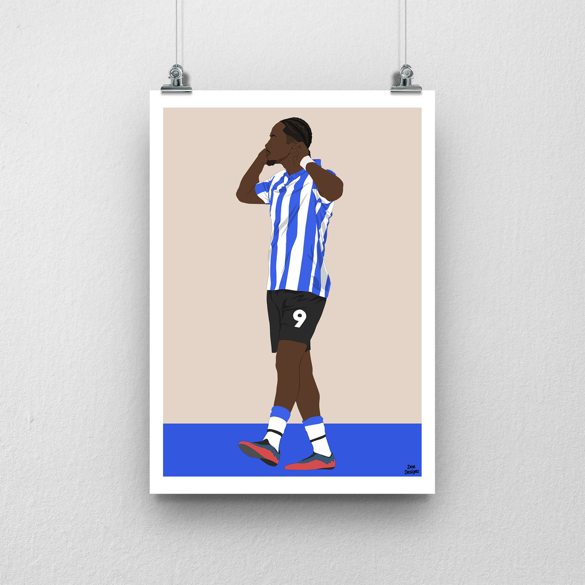 Jamal Lowe art print, holding both hands beside his face in Sheffield Wednesday's blue-and-white striped kit, against a beige background with a white border and blue base.