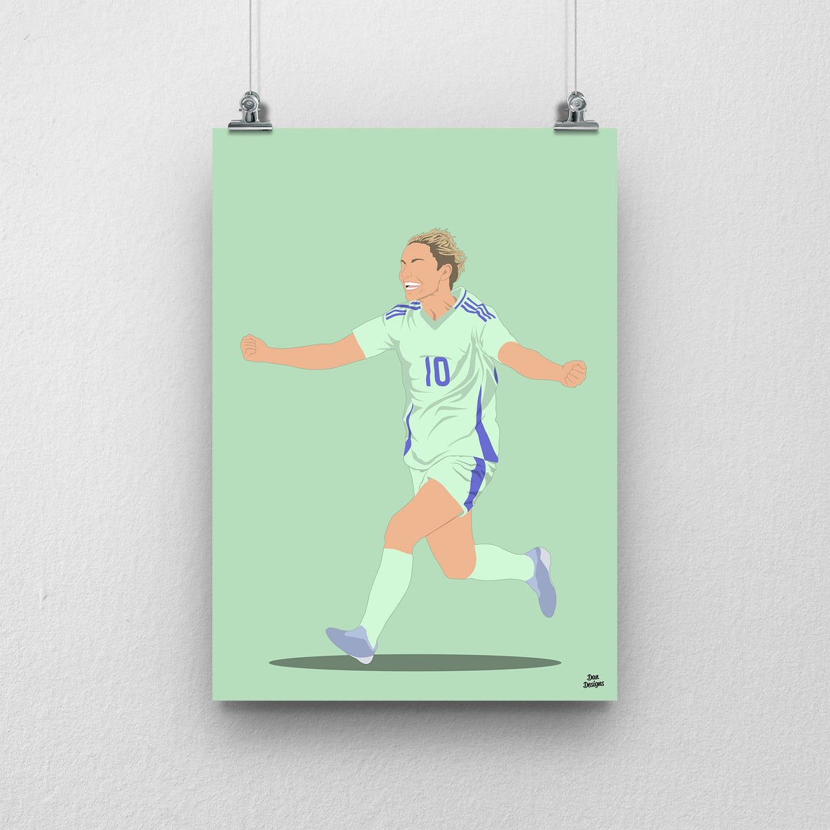 Jess Fishlock Wales print showing her arms-out celebration in the green away kit, on a green background.