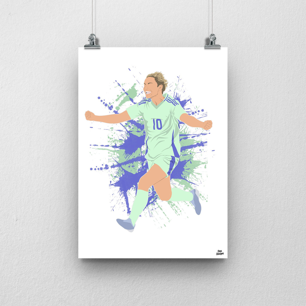 Jess Fishlock Wales print showing her arms-out celebration in the green away kit, on a green and purple paint-splatter background.