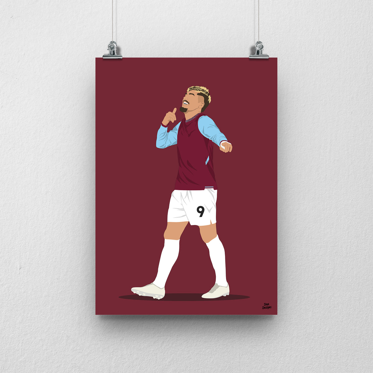 Joël Piroe in West Ham's claret shirt with sky-blue sleeves, holding a finger to his lips with his other arm extended, against a claret background.