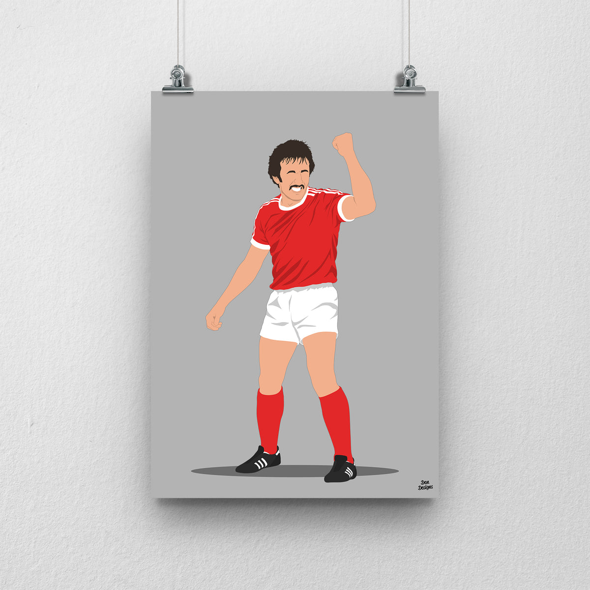 Joey Jones Wrexham print, raising his fist in the red Wrexham shirt, on a grey background.