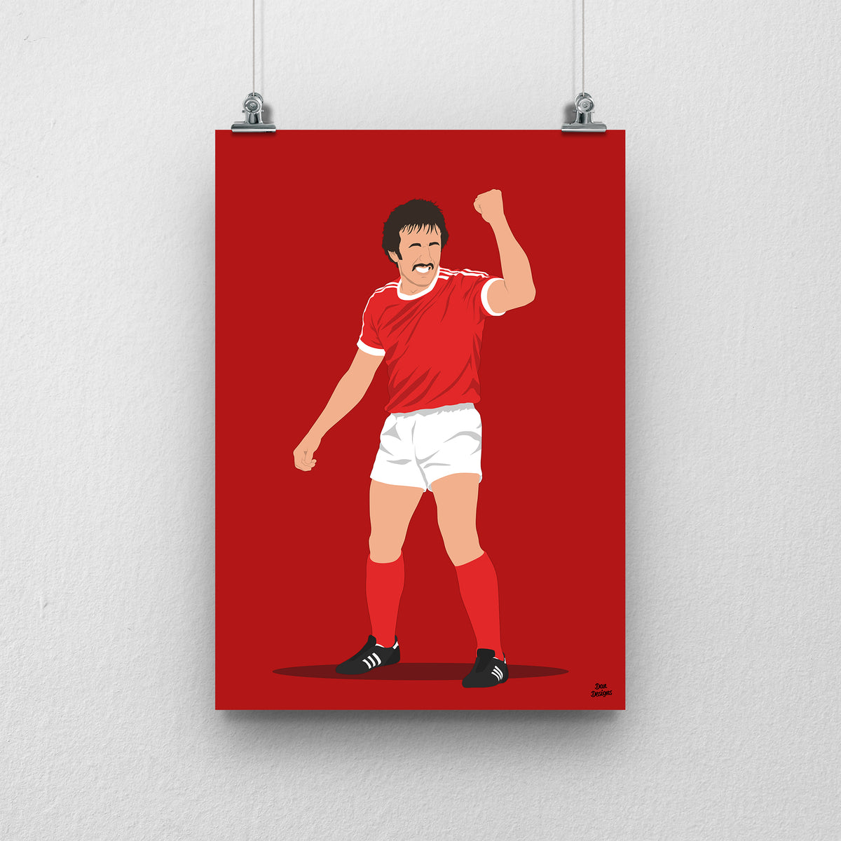 Joey Jones Wrexham print, raising his fist in the red Wrexham shirt, on a red background.