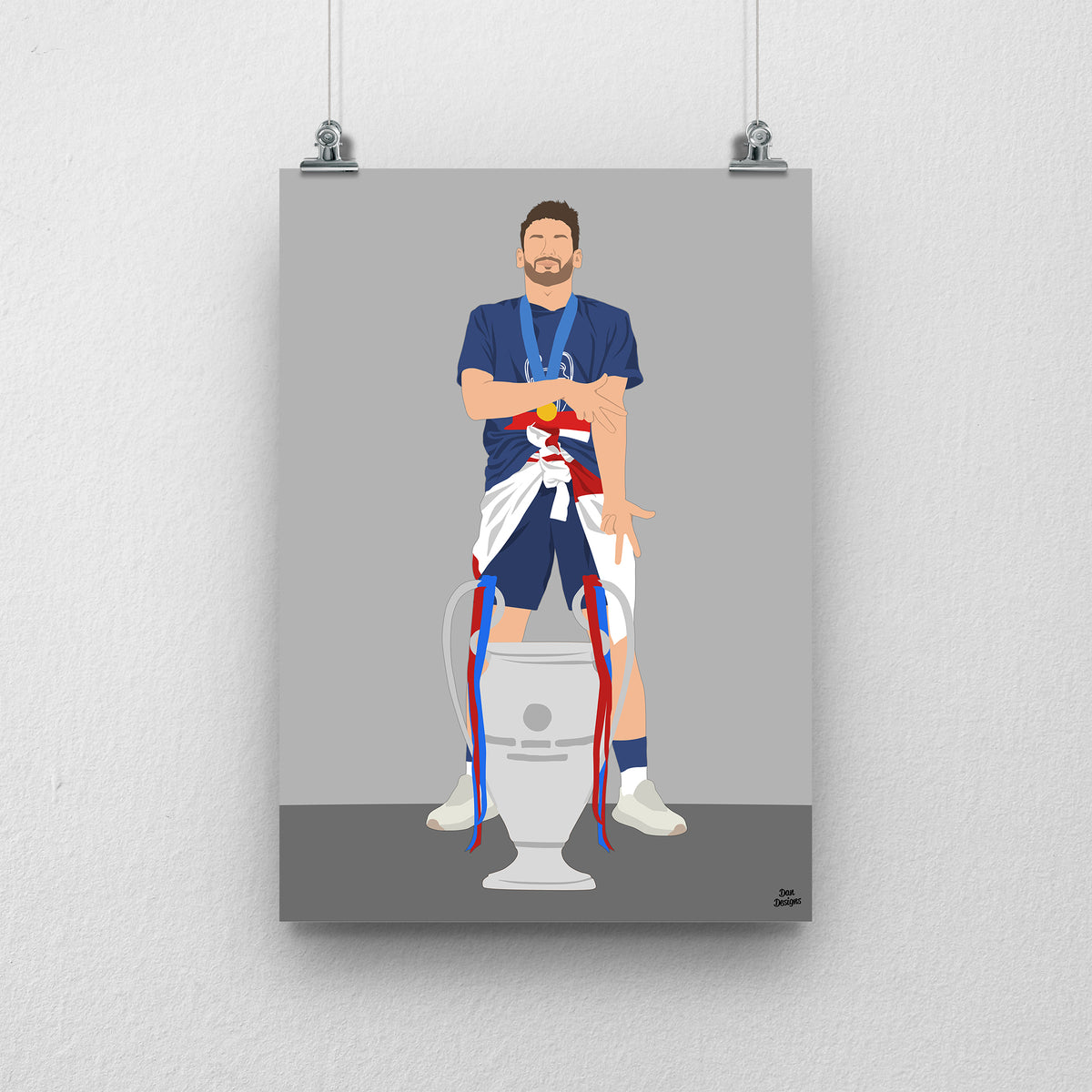 Khvicha Kvaratskhelia in a blue PSG kit, standing behind the Champions League trophy, against a grey background.