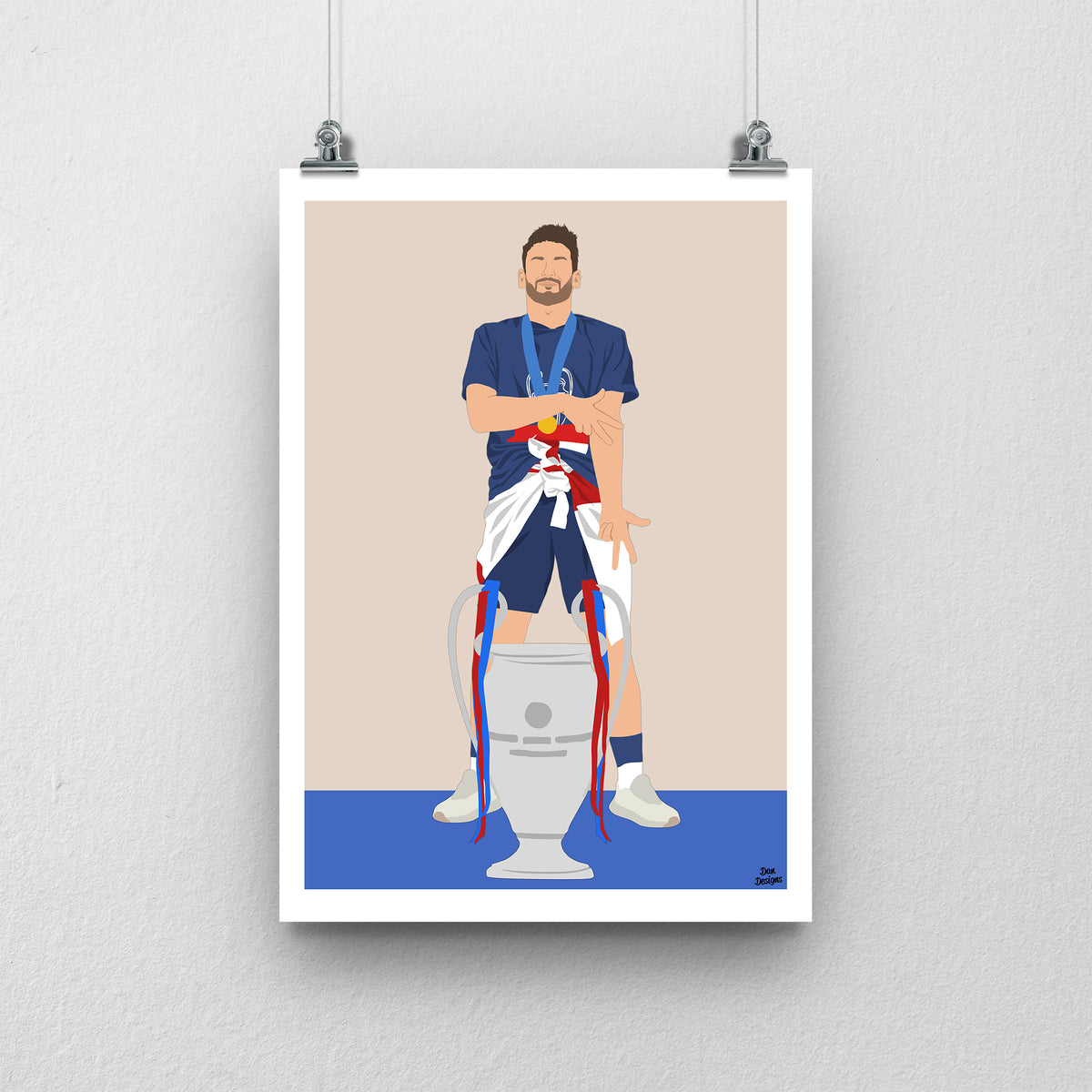 Khvicha Kvaratskhelia in a blue PSG kit, standing behind the Champions League trophy, against a beige background with a white border and blue base.