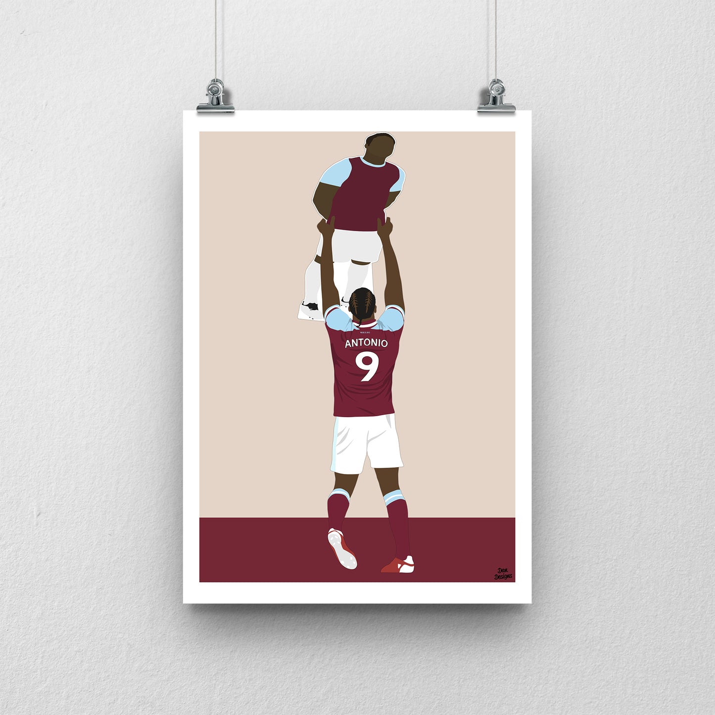 Michail Antonio West Ham United art print, holding a cardboard cut-out of himself above his head in the claret-and-blue kit, with a beige background, white border and club-colour base.