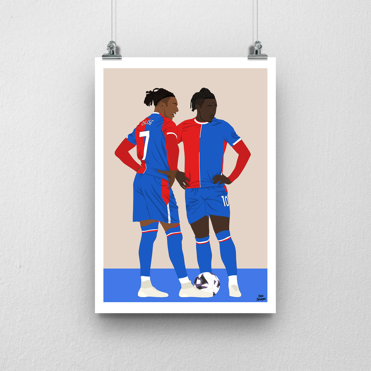 Michael Olise and Eberechi Eze Crystal Palace art print, standing together over a football in their red-and-blue kits, with a beige background, white border and club-colour base.