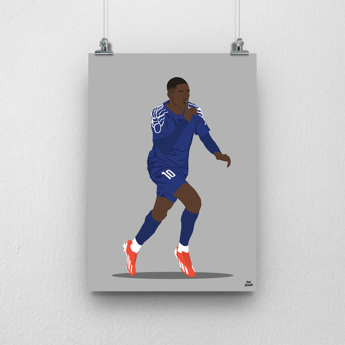 Ousmane Dembélé running in a dark blue PSG kit with pale shoulder patterns, one hand raised near his face, against a grey background.