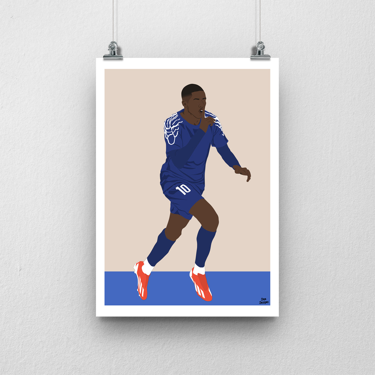 Ousmane Dembélé running in a dark blue PSG kit with pale shoulder patterns, one hand raised near his face, against a beige background with a white border and blue base.