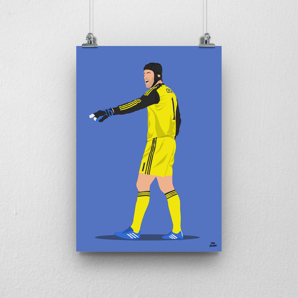 Petr Čech Chelsea art print, pointing across the pitch in a yellow goalkeeper kit, gloves and black protective headgear, with a blue background.