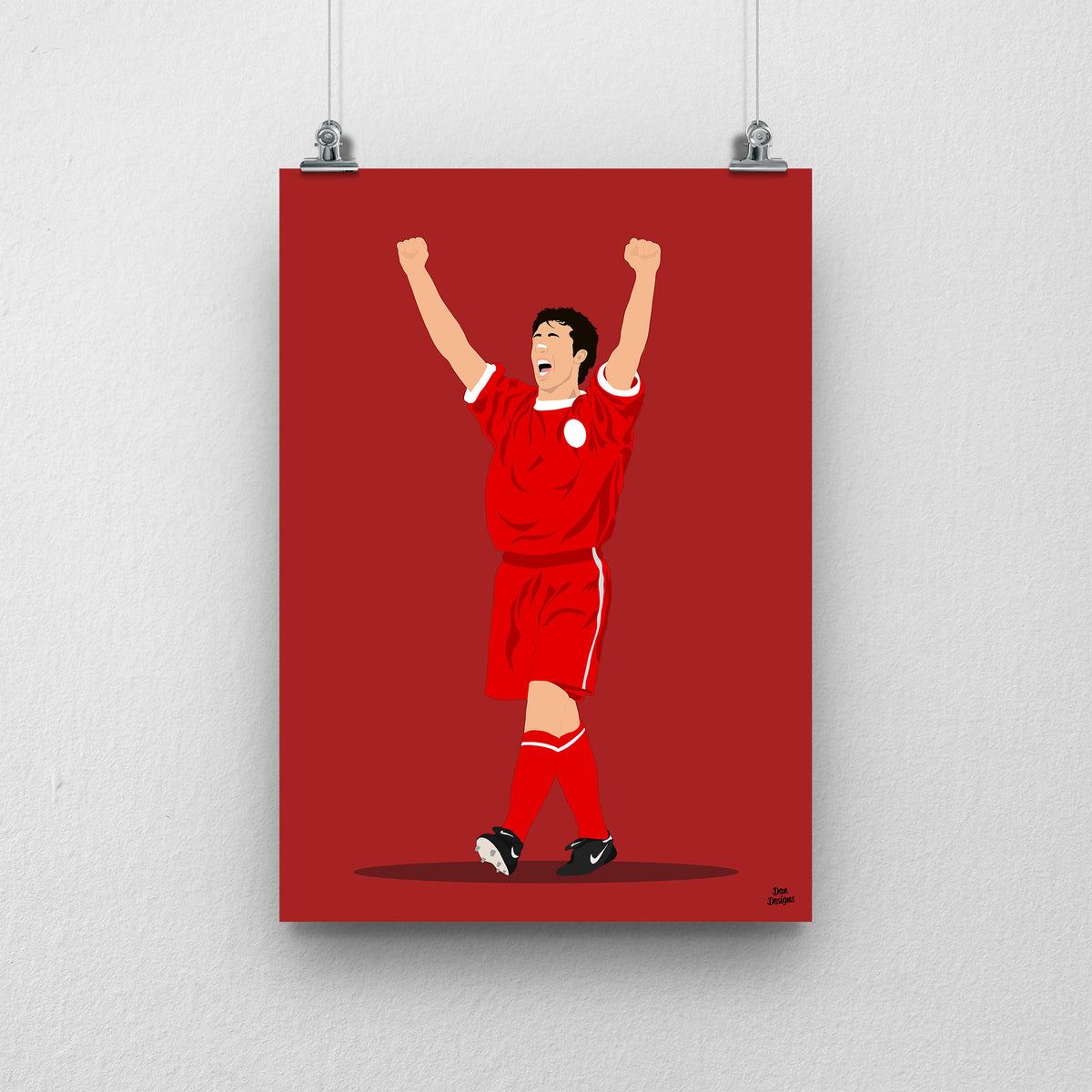 Robbie Fowler Liverpool print, celebrating with both arms raised in the red Liverpool kit, on a red background.
