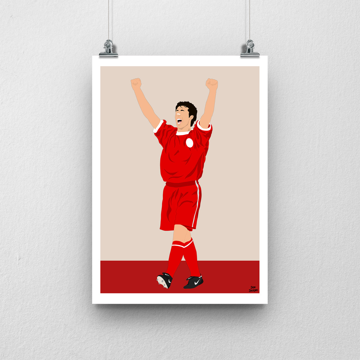 Robbie Fowler Liverpool print, celebrating with both arms raised in the red Liverpool kit, with a beige and red design and white border.