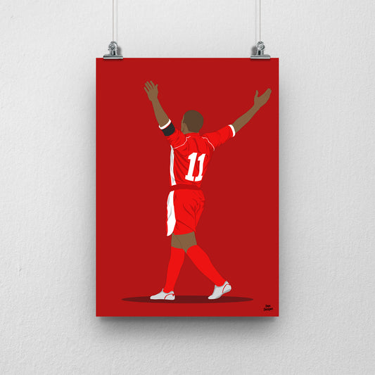 Robert Earnshaw Wales print, celebrating with both arms raised, viewed from behind, on a red background.