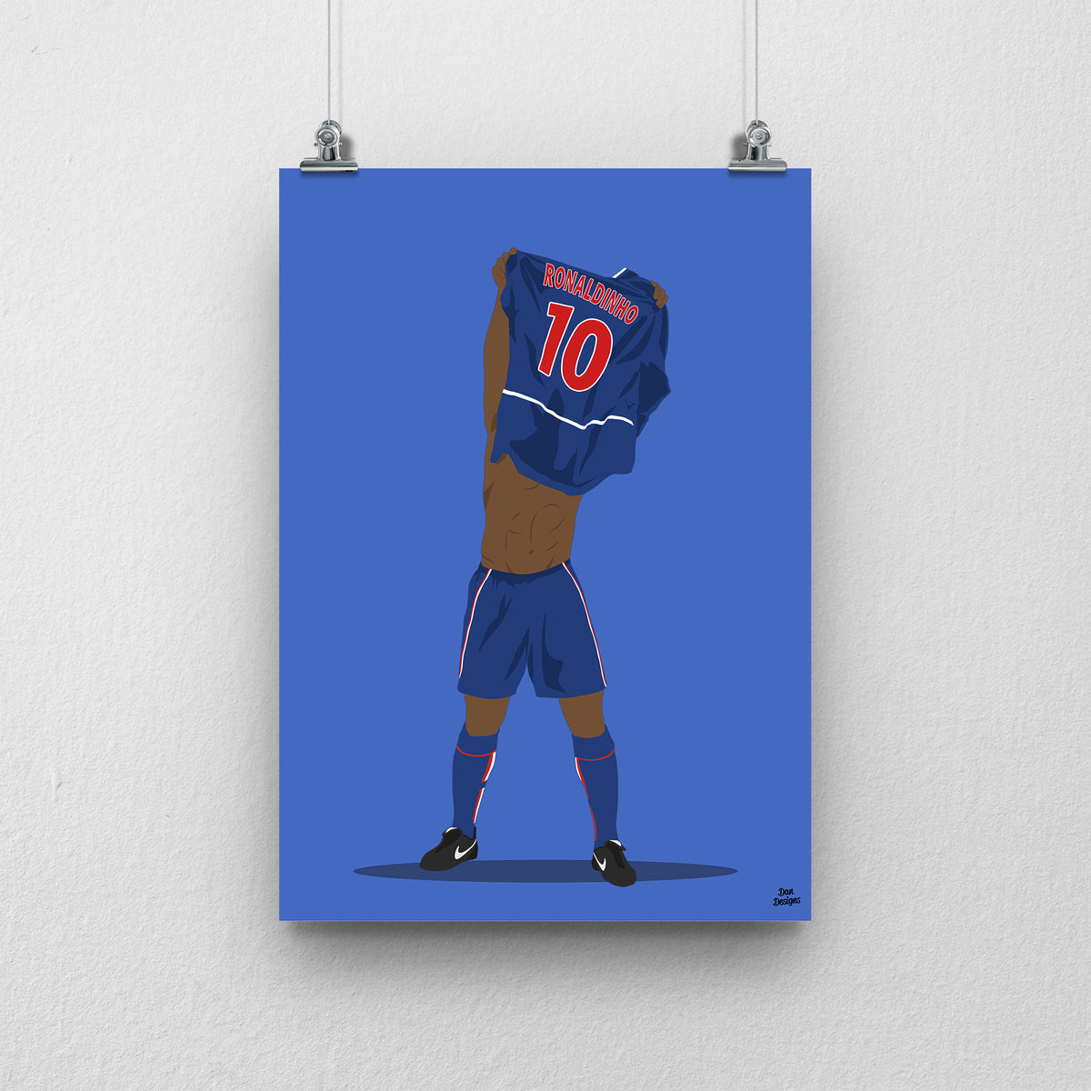 Ronaldinho art print, lifting his PSG shirt over his head with Ronaldinho and number 10 visible on the back, against a blue background.