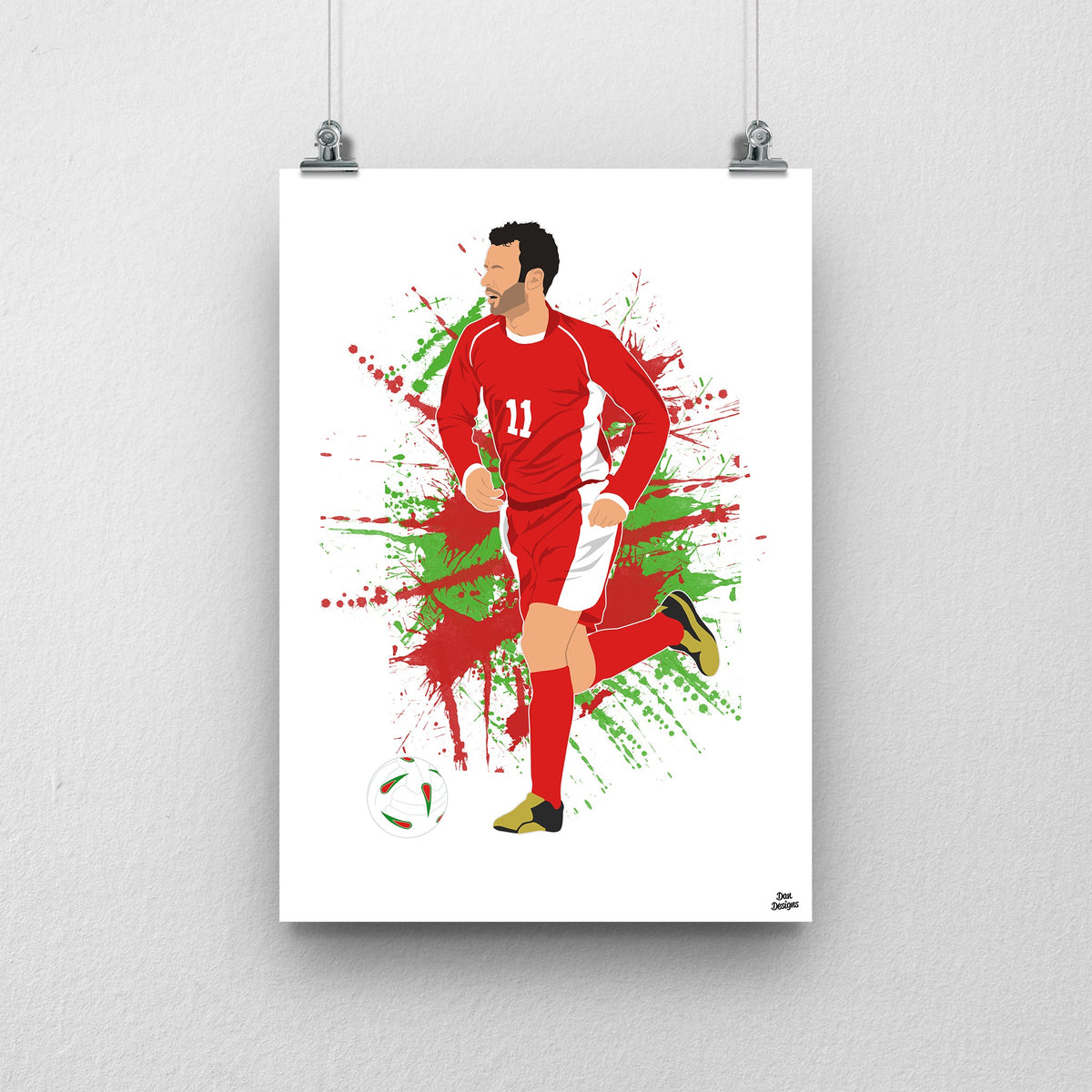 Ryan Giggs Wales print, running with the ball in the red Wales number 11 kit, on a red and green paint-splatter background.