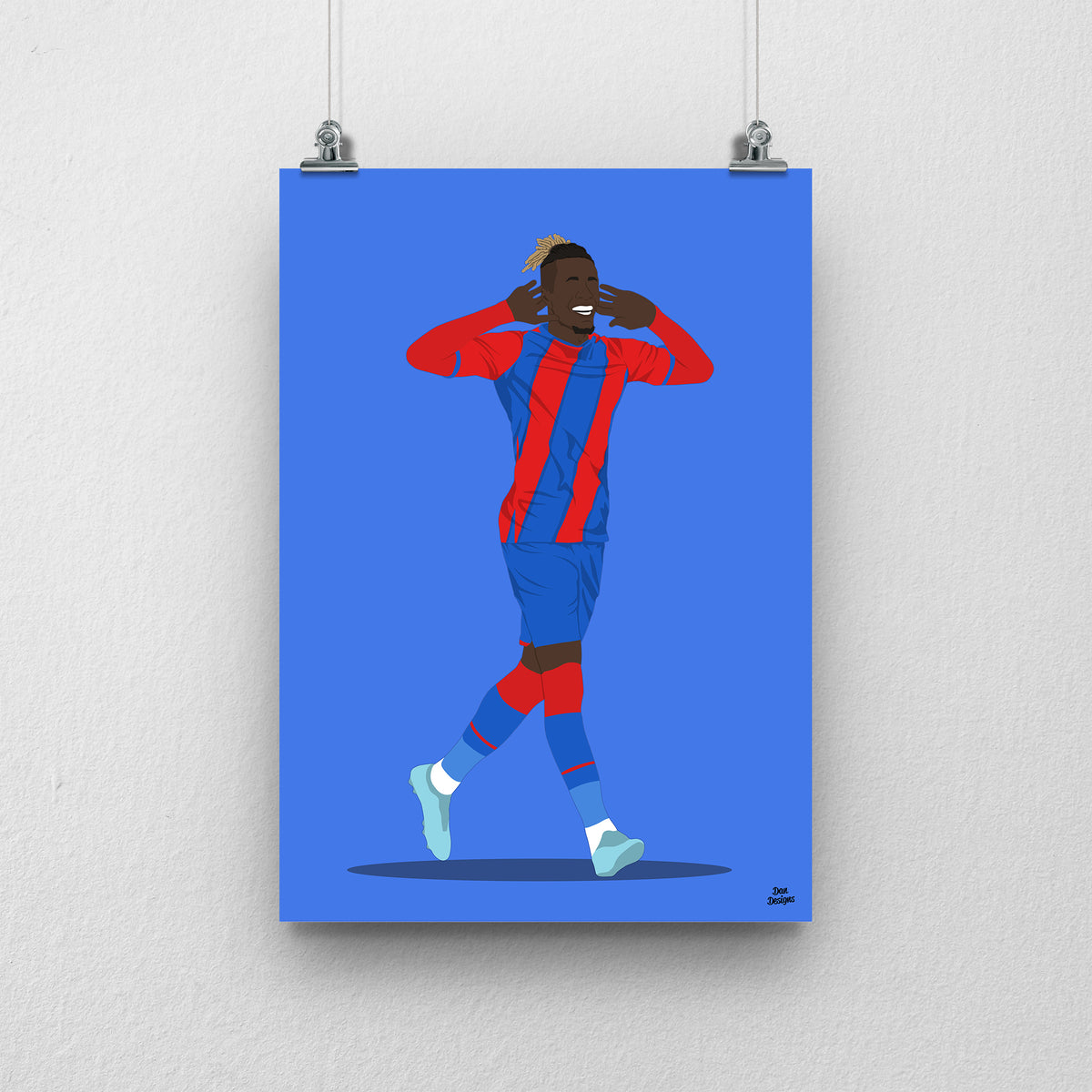 Wilfried Zaha Crystal Palace art print, celebrating with both hands beside his ears in the red-and-blue kit, with a blue background.