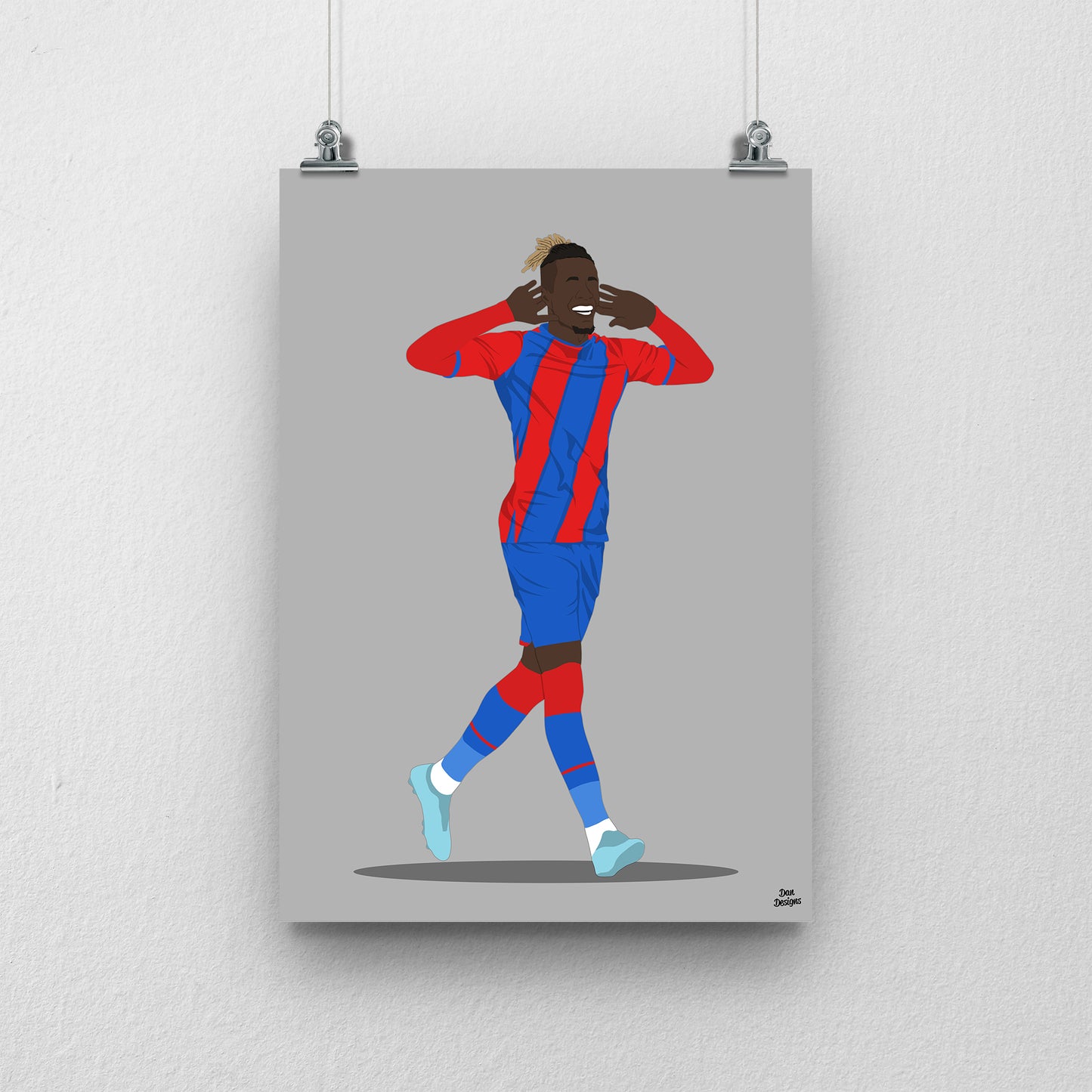 Wilfried Zaha Crystal Palace art print, celebrating with both hands beside his ears in the red-and-blue kit, with a grey background.