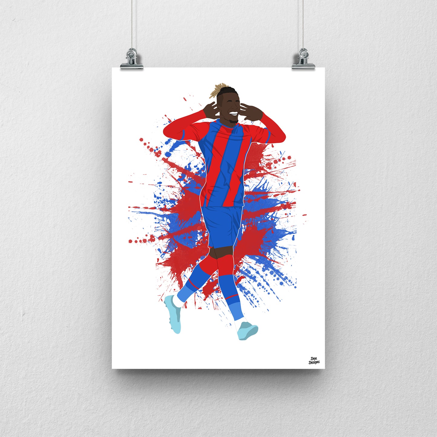 Wilfried Zaha Crystal Palace art print, celebrating with both hands beside his ears in the red-and-blue kit, with a paint-splatter background.