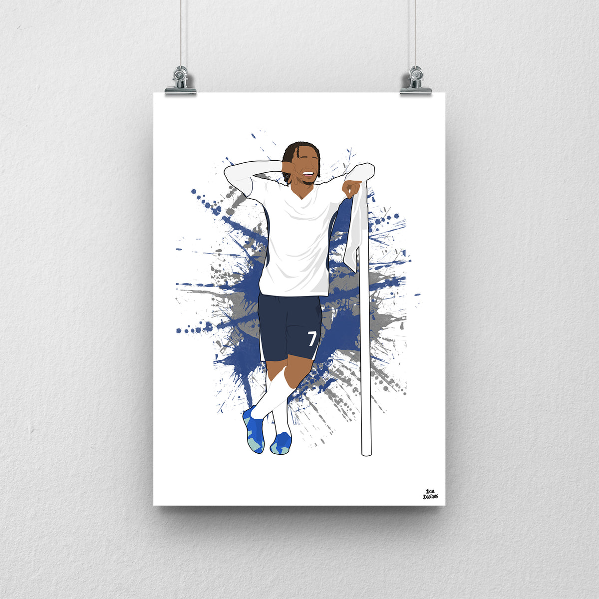 Xavi Simons Tottenham art print, posing beside a corner flag with one hand behind his head in a white Tottenham shirt and navy shorts, with a paint-splatter background.