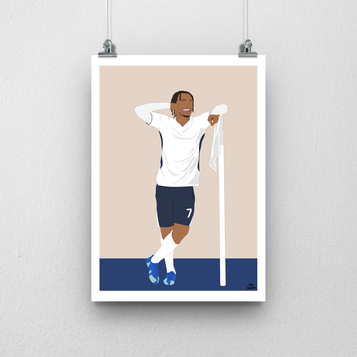 Xavi Simons Tottenham art print, posing beside a corner flag with one hand behind his head in a white Tottenham shirt and navy shorts, with a beige background, white border and club-colour base.