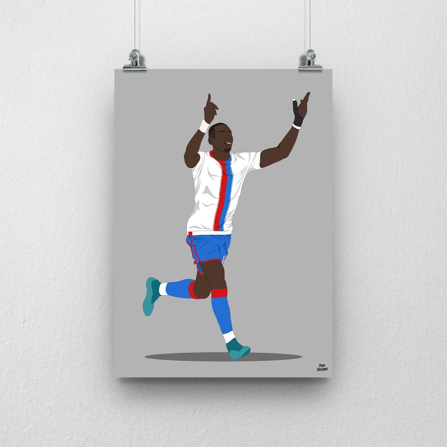 Yannick Bolasie Crystal Palace art print, celebrating with both hands pointing upwards in a white shirt with red-and-blue stripes, against a grey background.